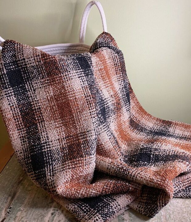 Brown check throw blanket made from fabric destined for landfill. This eco conscious sofa throw is also a great picnic blanket and chilly summer evenings.