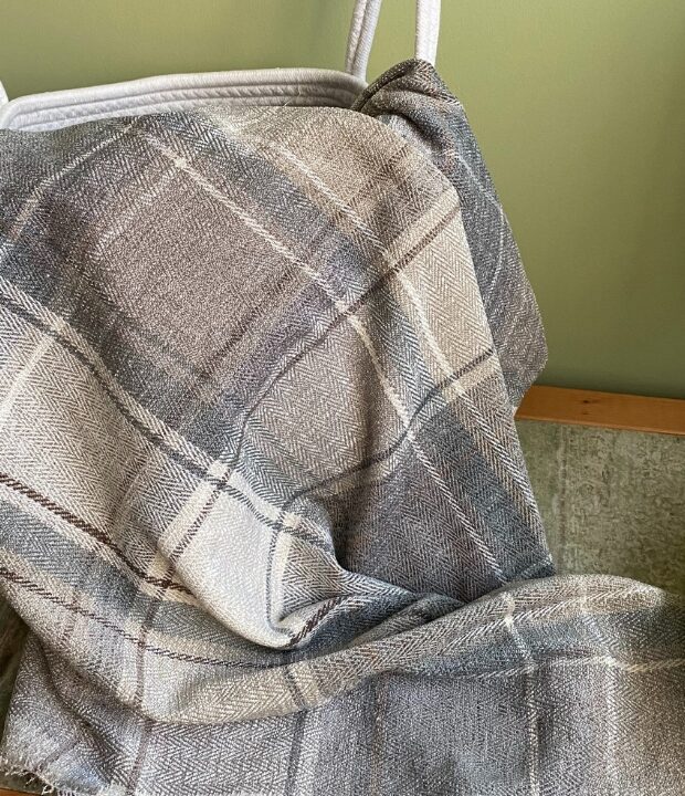 Soft grey throw blanket made from rescued fabric. Perfect to give any room a new look. Add elegance to your living space with this sumptuous throw blanket.